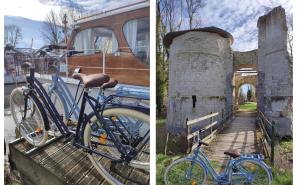 un par de bicicletas estacionadas al lado de un edificio en Bateaux à quai entre Amiens et la Baie de Somme- DOLFYN et ORKA en Eaucourt-sur-Somme