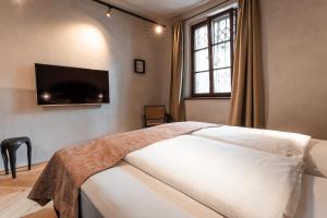 Ein Bett oder Betten in einem Zimmer der Unterkunft H5 Grauer Bär Studios & More