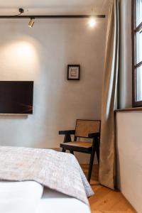 Ein Bett oder Betten in einem Zimmer der Unterkunft H5 Grauer Bär Studios & More