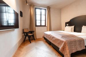 Ein Bett oder Betten in einem Zimmer der Unterkunft H5 Grauer Bär Studios & More
