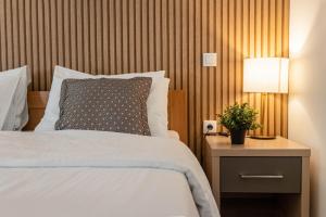 Postel nebo postele na pokoji v ubytování Zona Optimizma accommodation & SPA