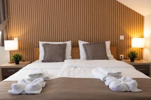Postel nebo postele na pokoji v ubytování Zona Optimizma accommodation & SPA