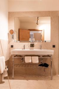 Ein Badezimmer in der Unterkunft H5 Grauer Bär Studios & More
