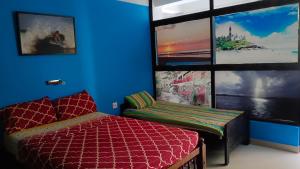 Voodi või voodid majutusasutuse Abhi's cafe avaduthura kovalam toas