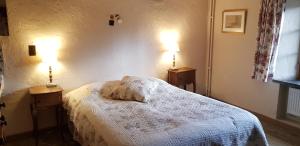 Postel nebo postele na pokoji v ubytování B&B Le Moulin de Resteigne