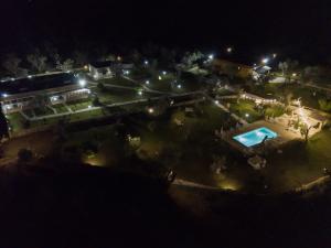 an overhead view of a park at night with a pool at Tenuta San Lorenzo in Otranto
