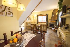 a kitchen with a table with a bowl of fruit on it at Catalunya Casas Private paradise - hop, skip or jump to Barcelona! in Cervelló