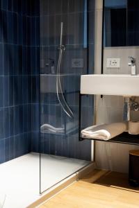 a bathroom with a shower and a sink at Dotcampus Roma City Center in Rome