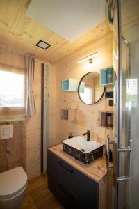 a bathroom with a sink and a toilet at Camp Ante-Gojko in Grebaštica +92 photos