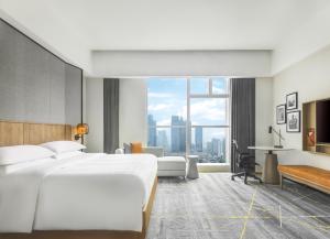 Postel nebo postele na pokoji v ubytování Sheraton Guangzhou Hotel