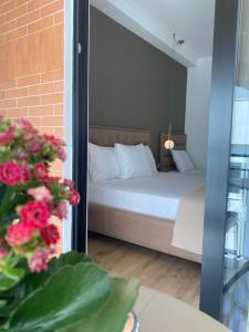 Postel nebo postele na pokoji v ubytování Augusto Rooms