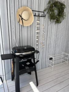 a hat sitting on a table with a hat on it at BUQEZ ECO RESORT - Beach Villas 2 and 8 - Seaview, new wifi! in Drage