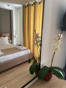Postel nebo postele na pokoji v ubytování Augusto Rooms
