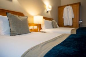 Letto o letti in una camera di Harcourt Hotel