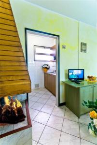 A television and/or entertainment centre at Glicini