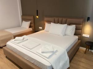 Postel nebo postele na pokoji v ubytování Augusto Rooms