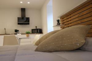a bedroom with a bed with a pillow on it at GOIZARTE Apartamentos turísticos rurales. 