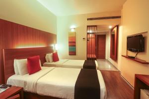 Postel nebo postele na pokoji v ubytování Orbett Hotel