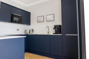 Kuchyň nebo kuchyňský kout v ubytování Oban Apartments + 7 fotografií