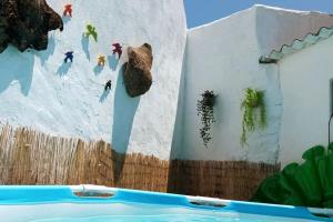 a mural of a bear on the side of a wall at A Casa do Barqueiro- Alentejo in Pedrógão