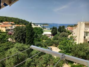 a view of a city with trees and buildings at Rocco-boy Apartment Hvar in Hvar