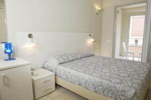 Postel nebo postele na pokoji v ubytování Domu Noa Hotel