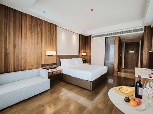 Postel nebo postele na pokoji v ubytování VM Hotel