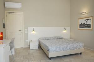 Postel nebo postele na pokoji v ubytování Domu Noa Hotel