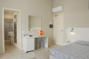 Postel nebo postele na pokoji v ubytování Domu Noa Hotel