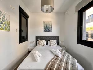 Voodi või voodid majutusasutuse Cape villa in Cabo de Roig toas