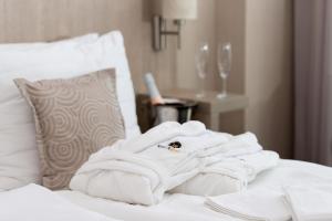 Postel nebo postele na pokoji v ubytování Košice Hotel