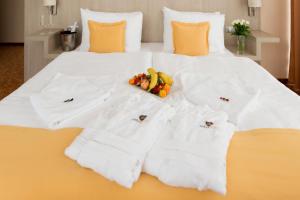 Postel nebo postele na pokoji v ubytování Košice Hotel