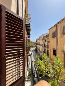 a view of an alley from a balcony at Stanze al Genio B&B in Palermo