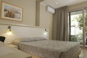 Postel nebo postele na pokoji v ubytování Domu Noa Hotel