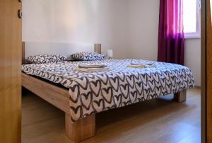 Postel nebo postele na pokoji v ubytování Antonio Apartments