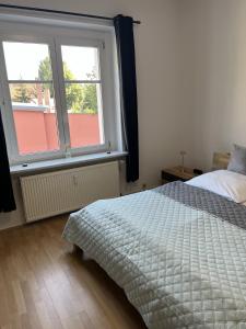 Кровать или кровати в номере Apartment 2 - Haus Lausitzring