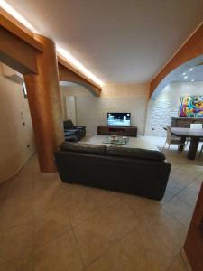 a large living room with a couch and a television at EDEN RELAX in Termoli