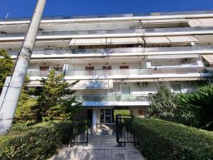 an external view of a building with a walkway at Apartment Near The Center Of Glyfada in Athens