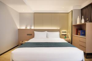 Letto o letti in una camera di Zhongshan Phoenix By Funyard