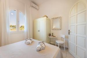 Ένα ή περισσότερα κρεβάτια σε δωμάτιο στο Villa Tre Palme