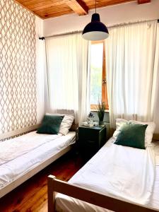 Ein Bett oder Betten in einem Zimmer der Unterkunft Happy Living Hostel