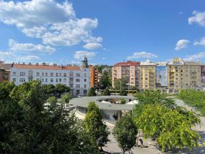 a view of a city with buildings and trees at Neighbor of Gellért Spa by NW in Budapest