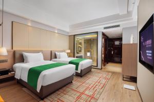Letto o letti in una camera di Zhongshan Phoenix By Funyard