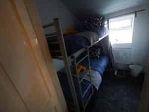 a group of bunk beds in a small room at Single Room - Sutherland Place in Derby