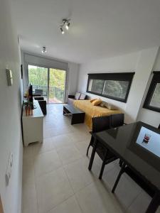 a bedroom with a bed and a table in a room at Magnifico Paradis Village in Salou