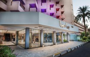 a store front of a building with glass doors at Pyramisa Hotel Luxor in Luxor