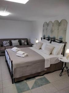 A bed or beds in a room at Erifili Houses