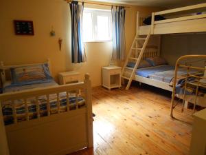 a bedroom with two bunk beds and a window at Hostel Del Mar in Varna City