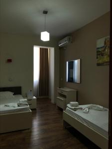 Postel nebo postele na pokoji v ubytování Divjaka Resort