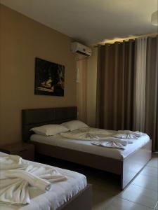 Postel nebo postele na pokoji v ubytování Divjaka Resort